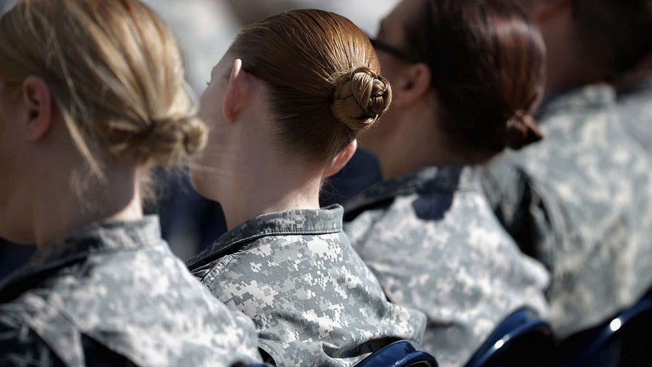 boot camp graduation picture, four women facing away from camera -military sexual assault