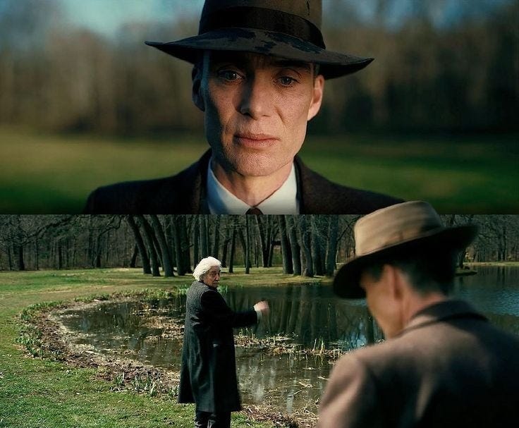 This may contain: an older man in a hat and suit is looking at another old man wearing a fedora