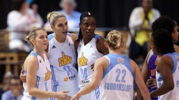 Sep 12, 2014; Chicago, IL, USA; Chicago Sky guard/forward Elena Delle Donne (11) is congratulated by teammates Allie Quigley (14) , Sylvia Fowles (34) and Courtney Vandersloot (22) after scoring a basket against the Phoenix Mercury during the first quarter in game three of the 2014 WNBA Finals at UIC Pavilion. Mandatory Credit: Jerry Lai-USA TODAY Sports
