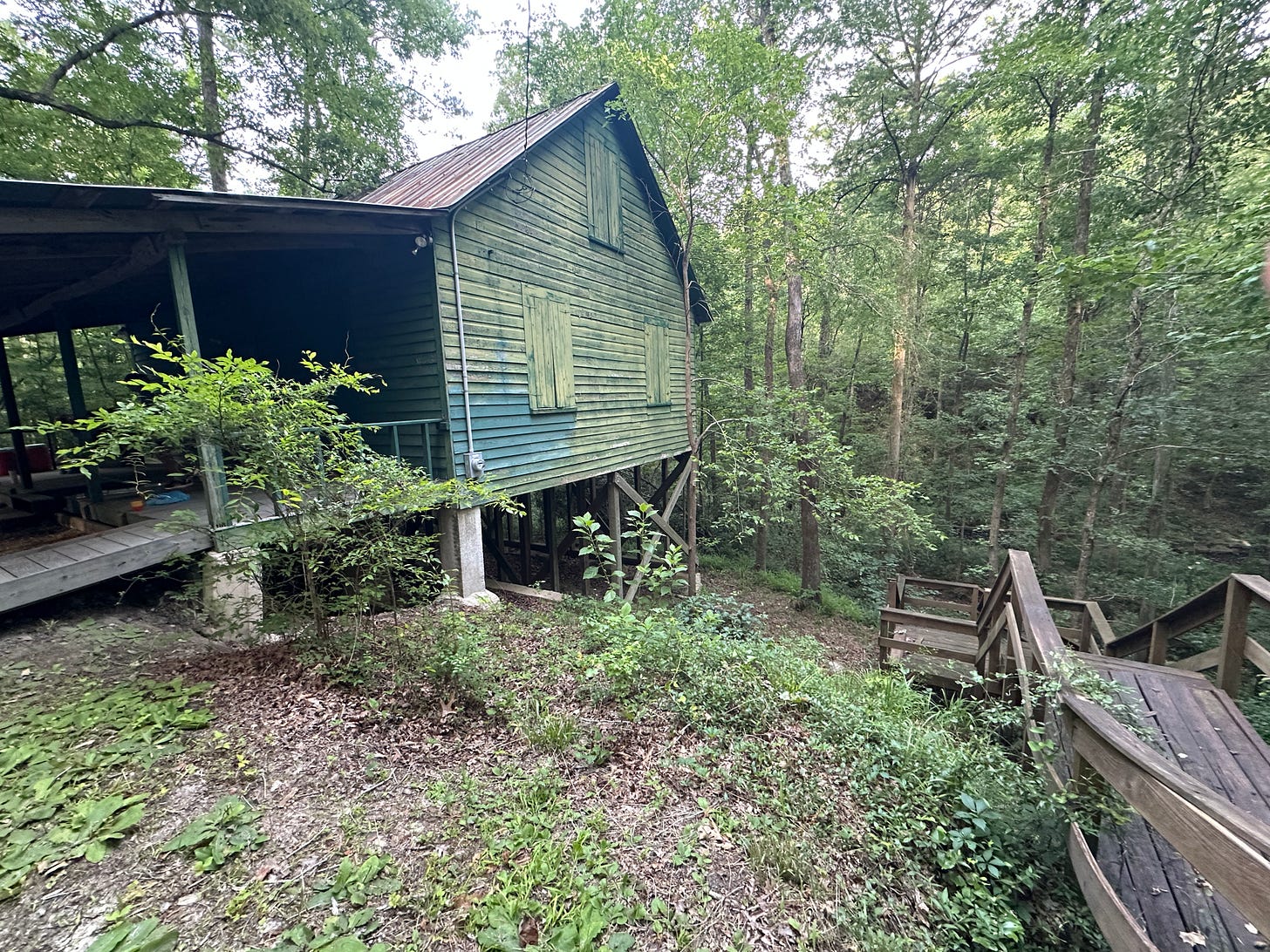 A mill high above a creek. A mill high above a creek.
