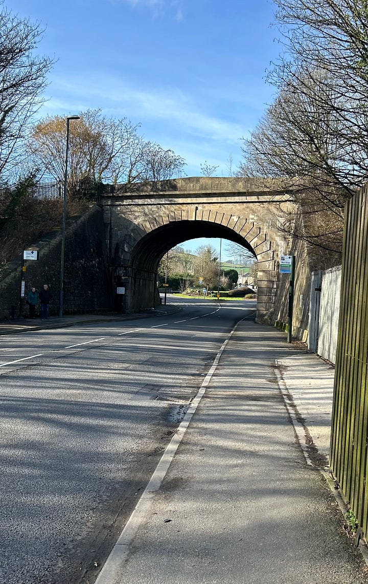 The four hundred years old bridge crossing the By Brook, Bathford with its ancient arches supporting the modern road. Brunel's railway bridge further along crossing the same raod.