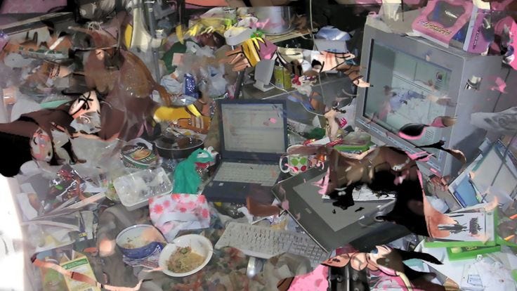 This may contain: a pile of clutter with an open laptop computer on top of it and lots of toys