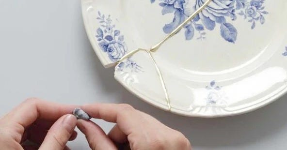 A plate being mended and improved by Kintsugi A plate being mended and improved by Kintsugi