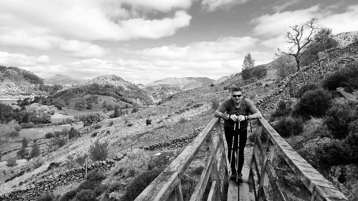 Black and white pictures depict Stuart Rimmer during the Great Lakeland Mountain Marathon