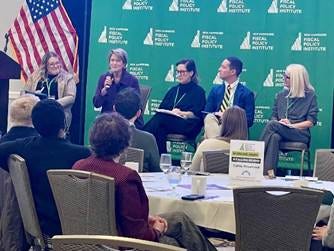 A group of people sitting around a table

AI-generated content may be incorrect.