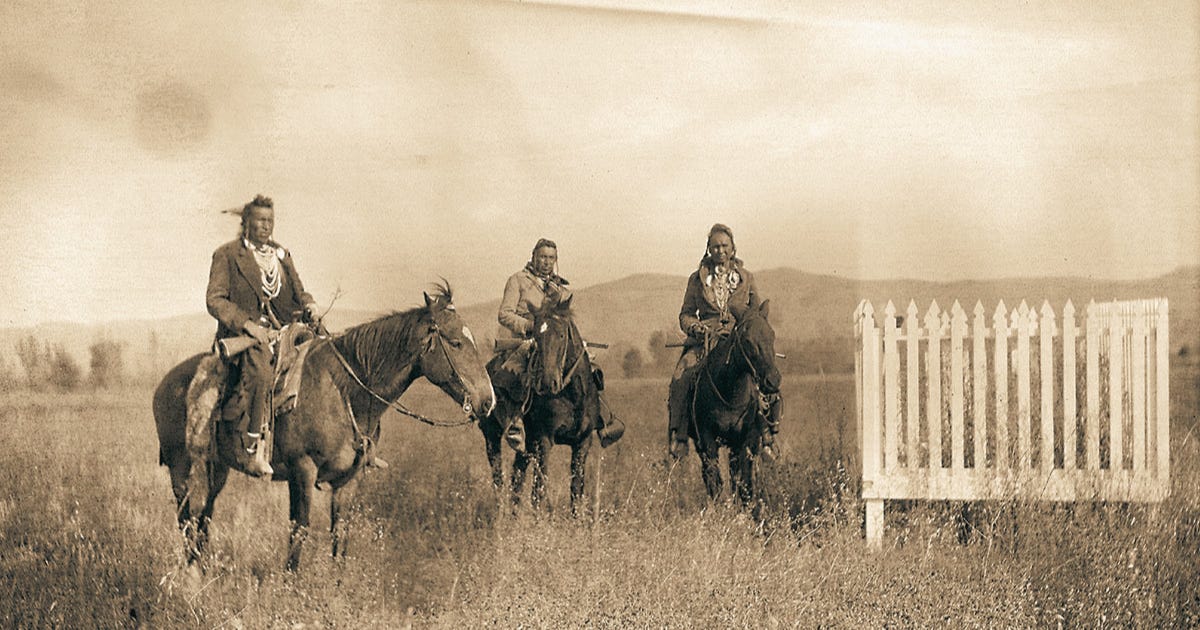Photo of White Man Runs Him and two other scouts visiting the battle ground in 1907.