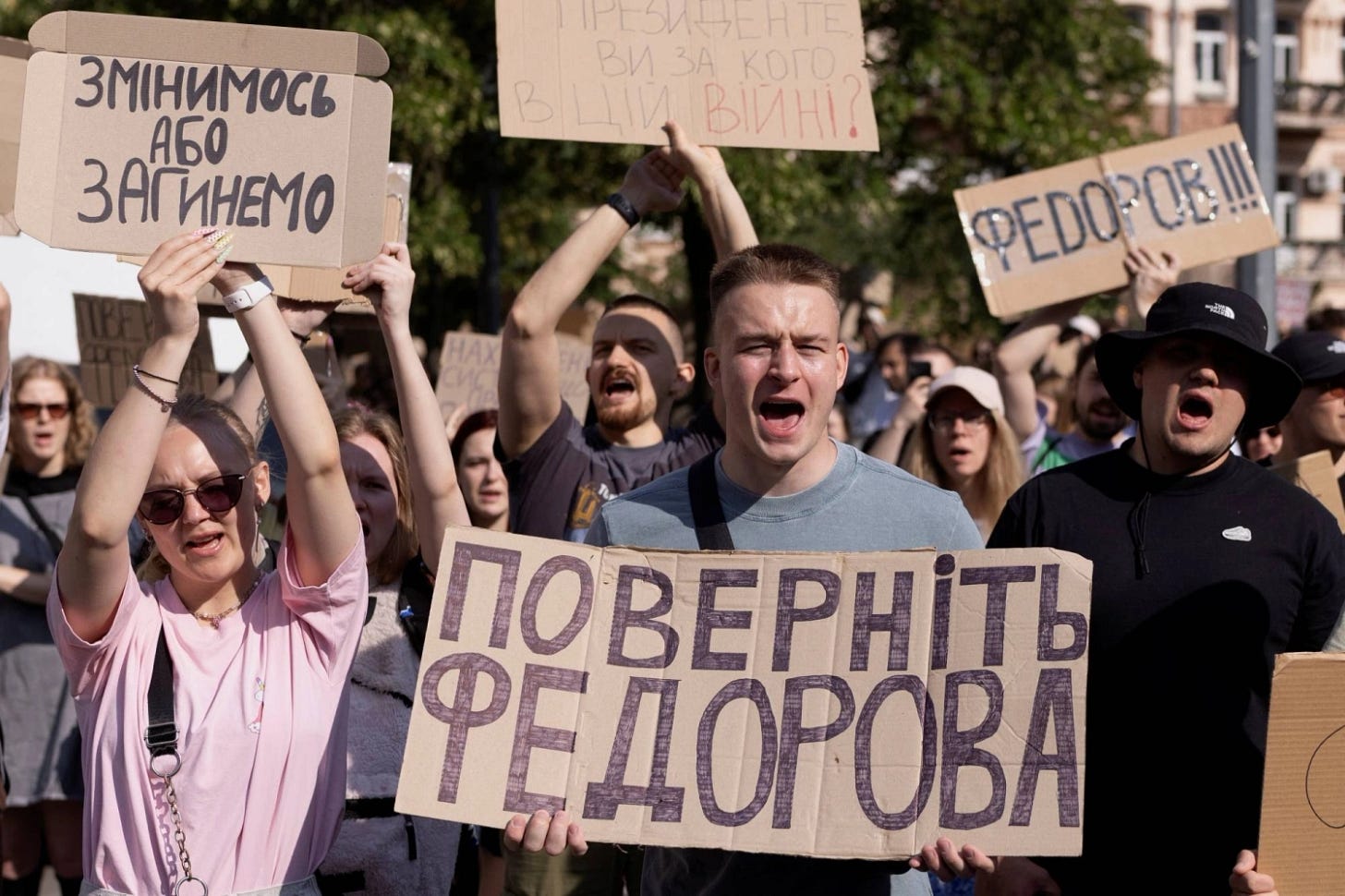People protest Ukrainian President Volodymyr Zelenskyy's decision to replace Mykhailo Fedorov as defense minister in Kyiv on Thursday. People protest Ukrainian President Volodymyr Zelenskyy's decision to replace Mykhailo Fedorov as defense minister in Kyiv on Thursday.