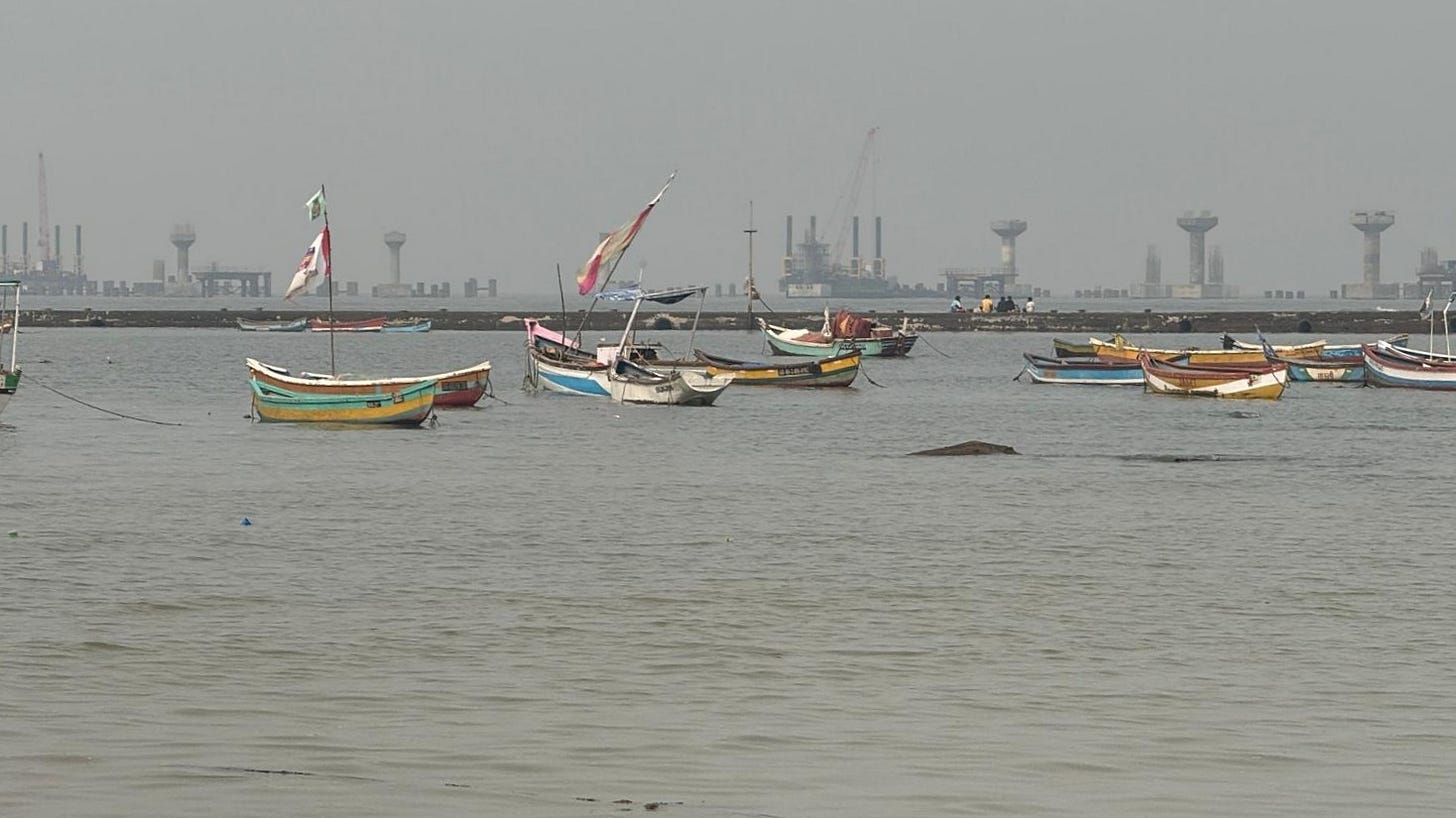 dinhies float along the coastline of the Arabian Sea dinhies float along the coastline of the Arabian Sea