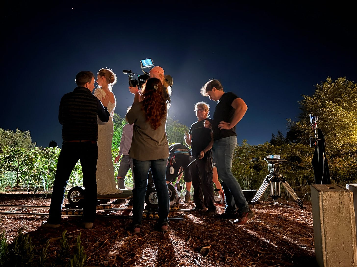 Lead actress Danielle LaRauf stands on a camera dolly surrounded by crew while director Courtney Hoskins sets the scene for The Not.