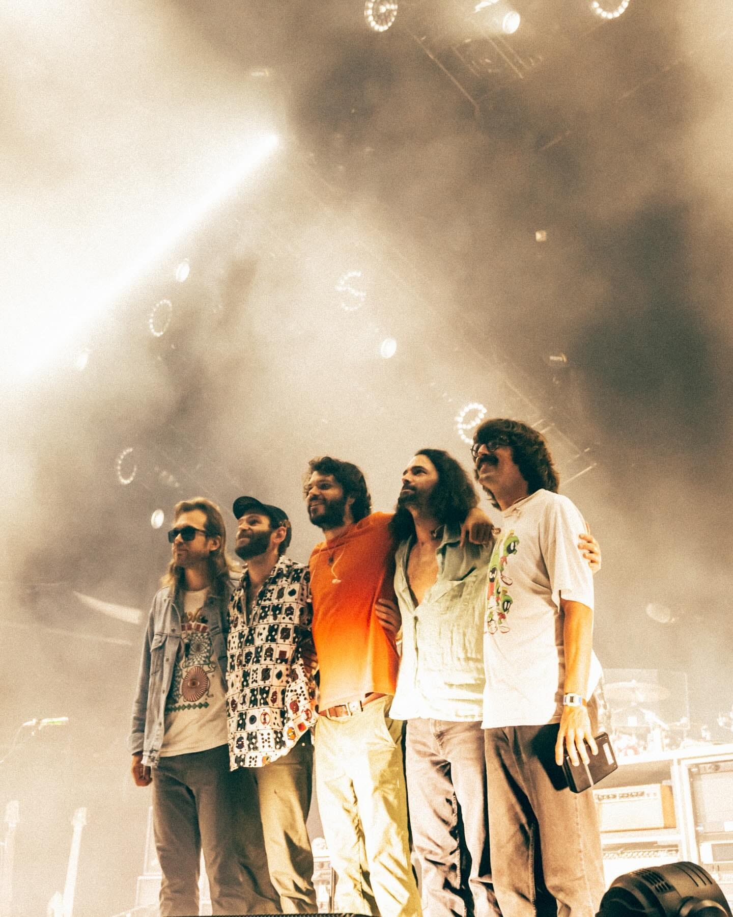 May be an image of 3 people, crowd and text