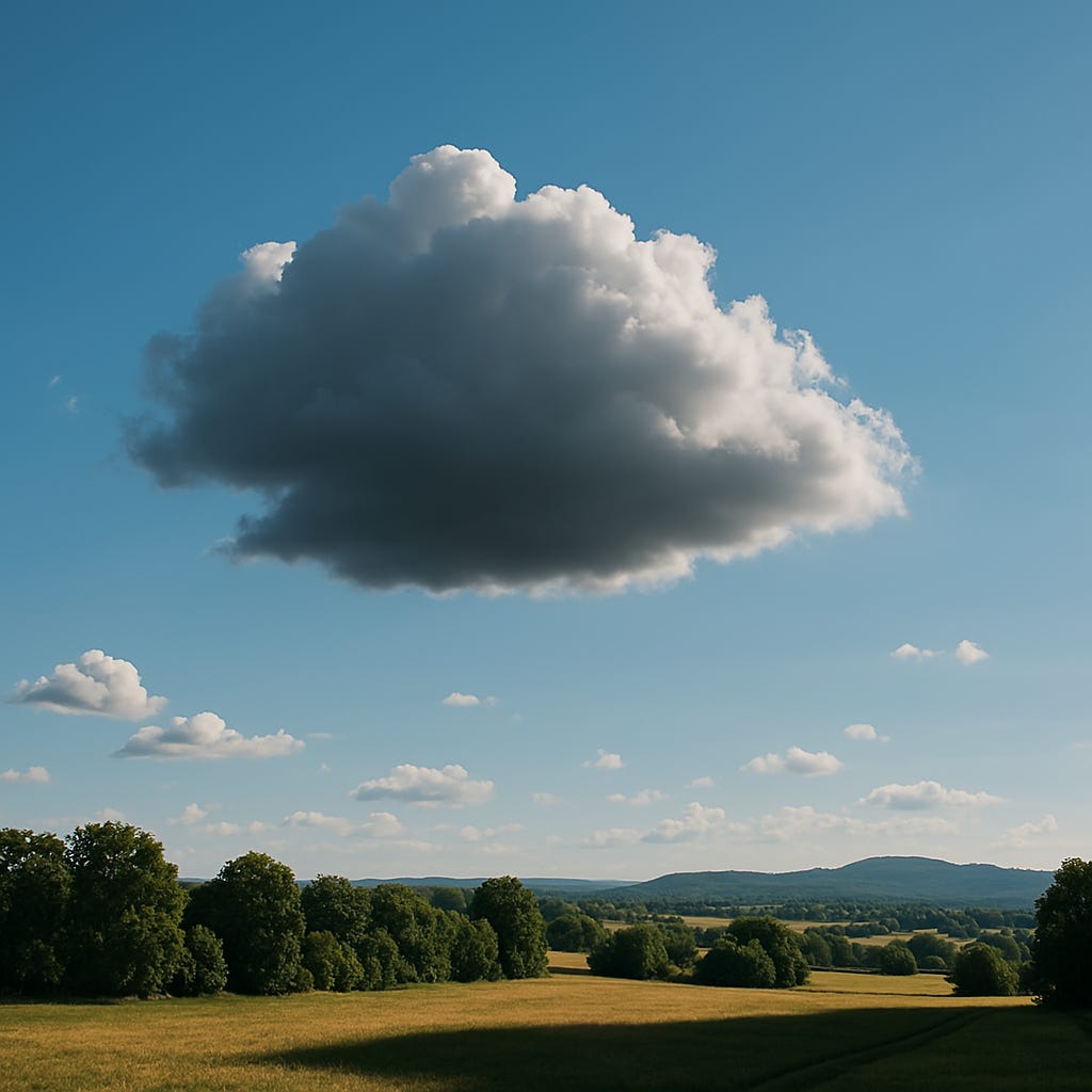 A large dark cloud floats in a bright blue sky over a sunlit countryside, casting a visible shadow across the grassy landscape.