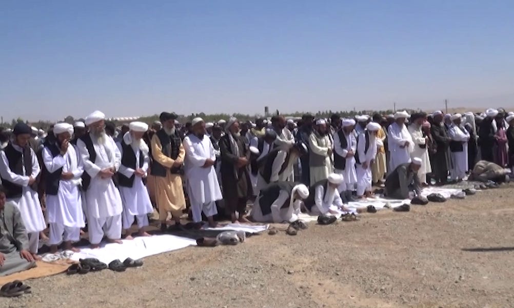 A group of people in white robes

Description automatically generated with low confidence