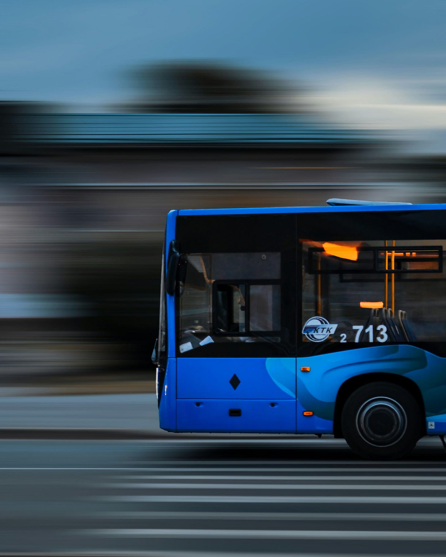 Blue and White Bus on Road Blue and White Bus on Road
