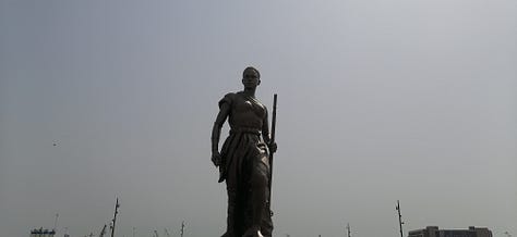 Pictures of the artwork on sale at the Marche des Arts de Cotonou, the Amazone statue, the Benin Congress building, and the second largest graffiti wall in the world