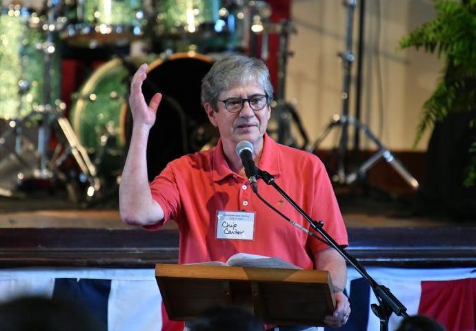 Chip Carter, son of  Jimmy and Rosalynn Carter, speaks during his parents' 75th wedding anniversary celebration at Plains High School in Plains on Saturday, July 10, 2021. (Hyosub Shin / Hyosub.Shin@ajc.com)