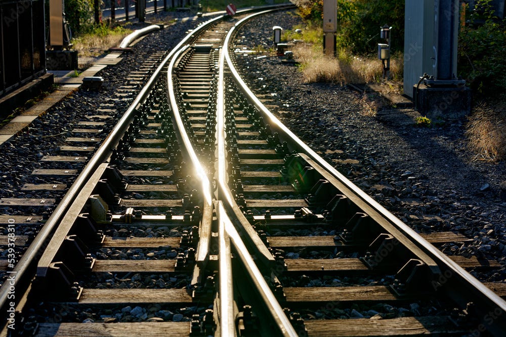 Close-up of beautiful railway switch point with reflection of late afternoon sun at village Brienz, Bernese Oberland, on an autumn day. Photo taken October 19th, 2022, Brienz, Switzerland.
