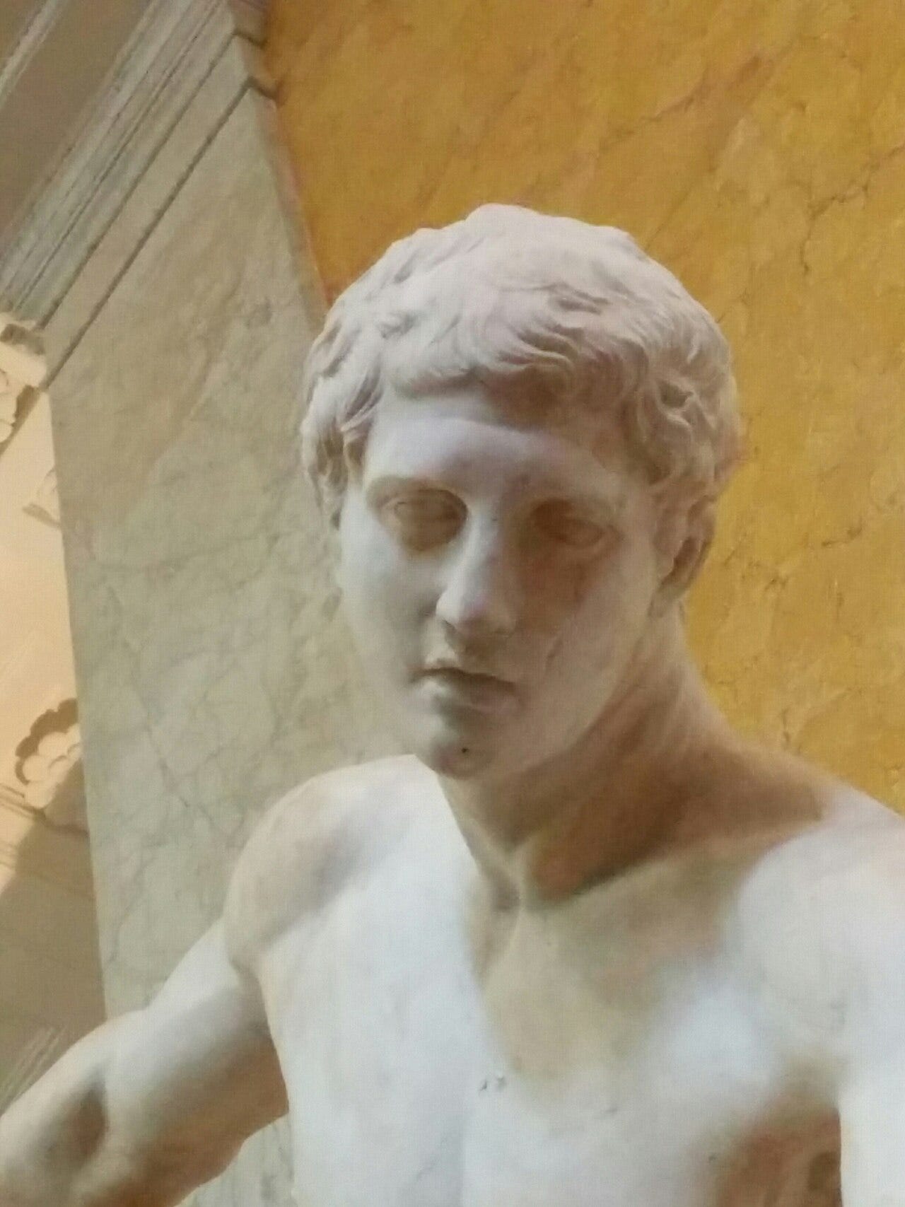 Athlete coiled to throw a discus, marble copy Athlete coiled to throw a discus, marble copy