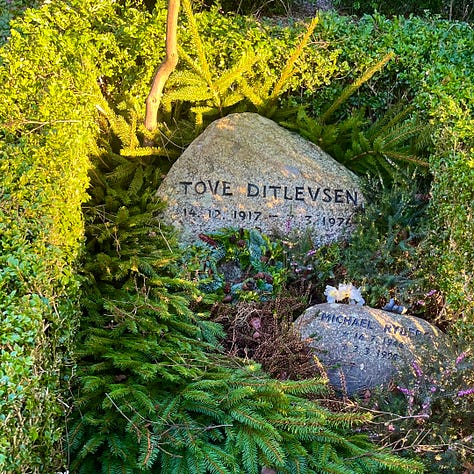 Tove Ditlevsen's simple stone, a battered folding chair leans next to an Arabic grave planted with flowers; Hells Angel gravestone with candle holder and plants