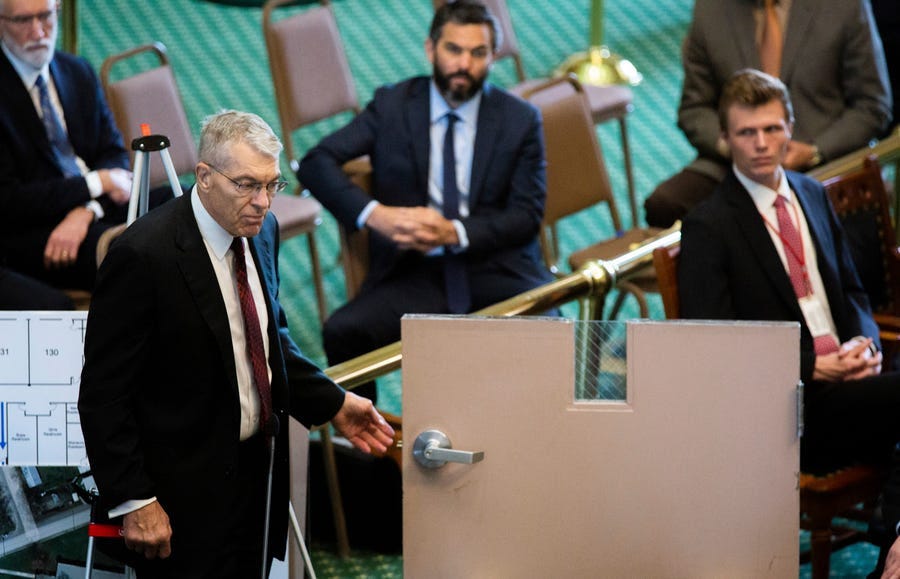 Texas Department of Public Safety Director Steve McCraw shows how an interior door in Robb Elementary School failed to lock securely to the Texas Senate Special Committee to Protect All Texans during the hearing at the Texas State Capitol in Austin, Tuesday, June 21, 2022.