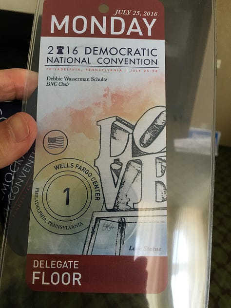 My Journey with Bernie book, DNC 2016, Independence Hall, Green glow-in-the-dark shirts, 2016 DNC Delegate Badge, Delegates, Protestors, and Volunteers in Philadelphia, Lighted FEEL THE BERN Shirt
