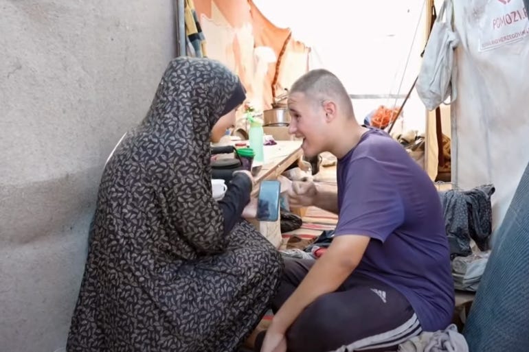 A mother cares for her autistic child in a tent.