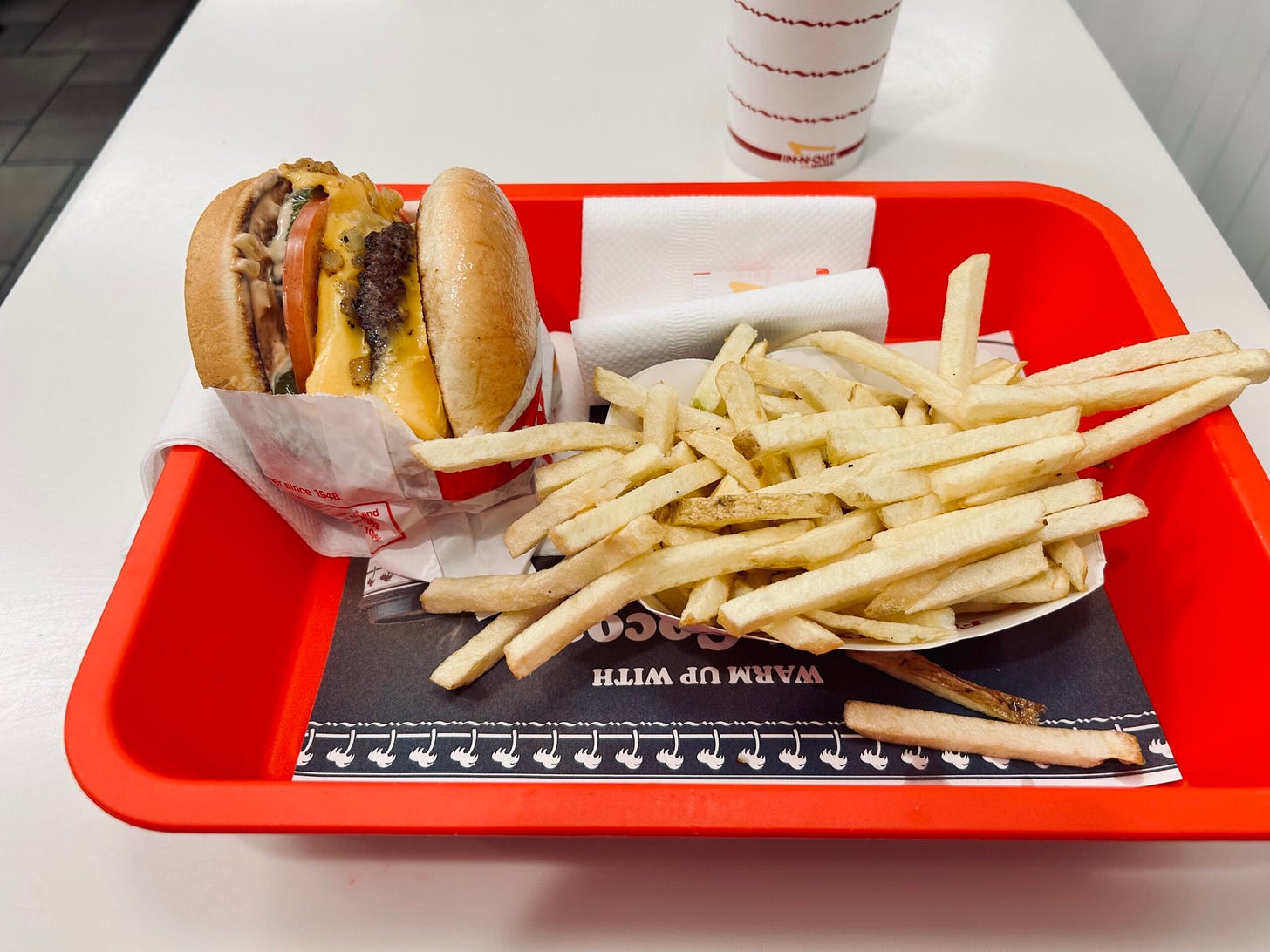 burger, fries, drink, tray, paper, napkins, table