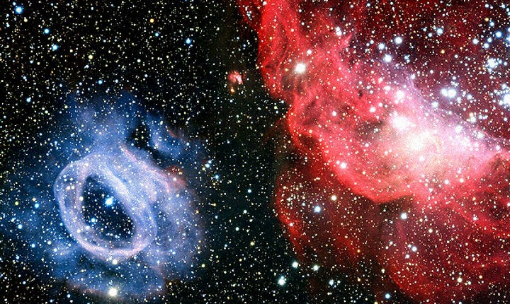 An image of the Large Magellanic Cloud (LMC), showing two glowing gas clouds. On the left is NGC 2020, a blue gas cloud with a ring-like structure, and on the right is NGC 2014, a red gas cloud with a more irregular shape. The background is filled with numerous stars. The text above the image describes the LMC as an irregular galaxy and the largest satellite galaxy of the Milky Way, located about 163,000 light-years away. It has a bar structure and is rich in gas and star-forming regions, making it a site of intense star formation. The caption notes the two gas clouds within the LMC. An image of the Large Magellanic Cloud (LMC), showing two glowing gas clouds. On the left is NGC 2020, a blue gas cloud with a ring-like structure, and on the right is NGC 2014, a red gas cloud with a more irregular shape. The background is filled with numerous stars. The text above the image describes the LMC as an irregular galaxy and the largest satellite galaxy of the Milky Way, located about 163,000 light-years away. It has a bar structure and is rich in gas and star-forming regions, making it a site of intense star formation. The caption notes the two gas clouds within the LMC.