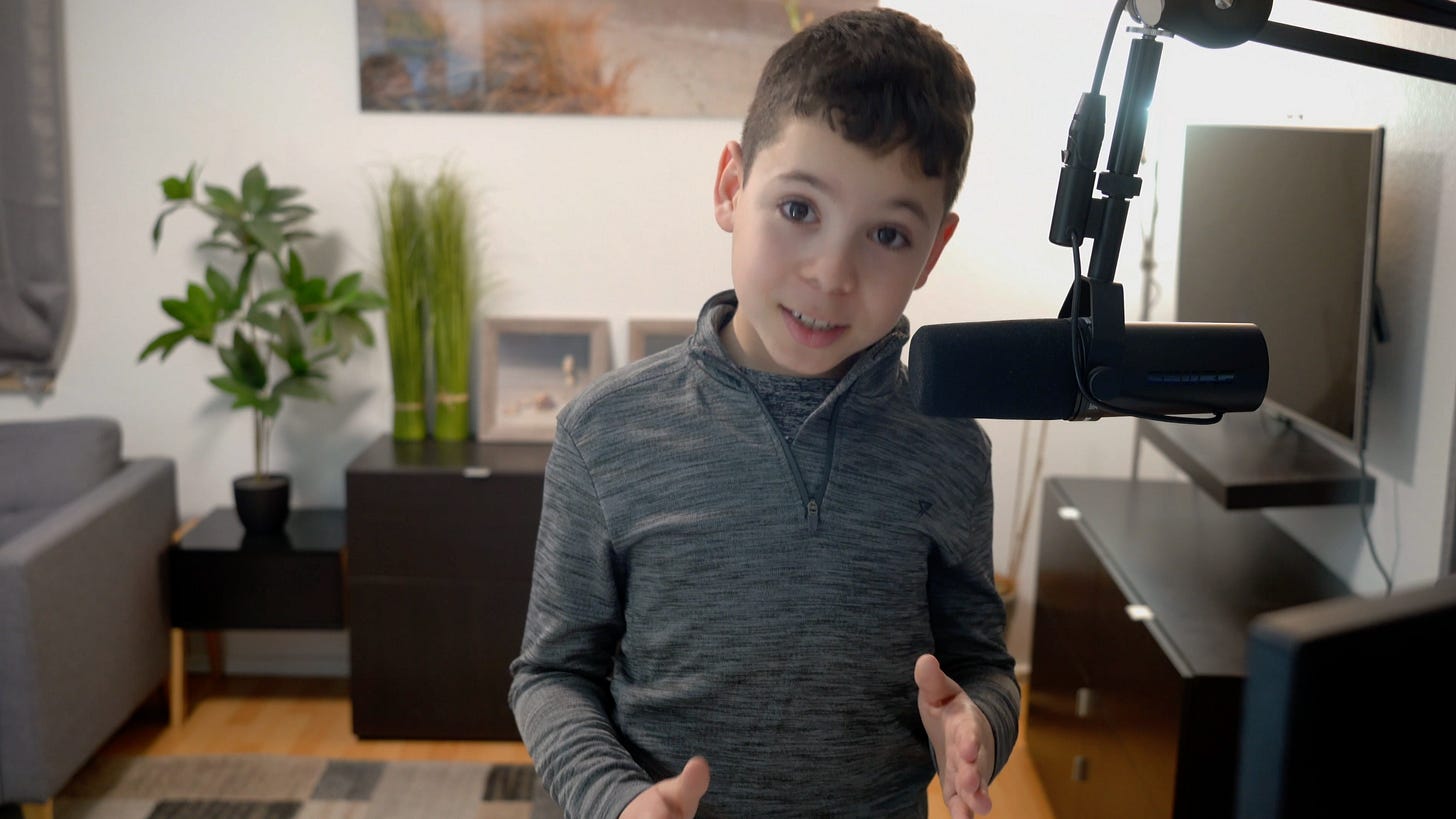My son in front of the camera recording a YouTube video