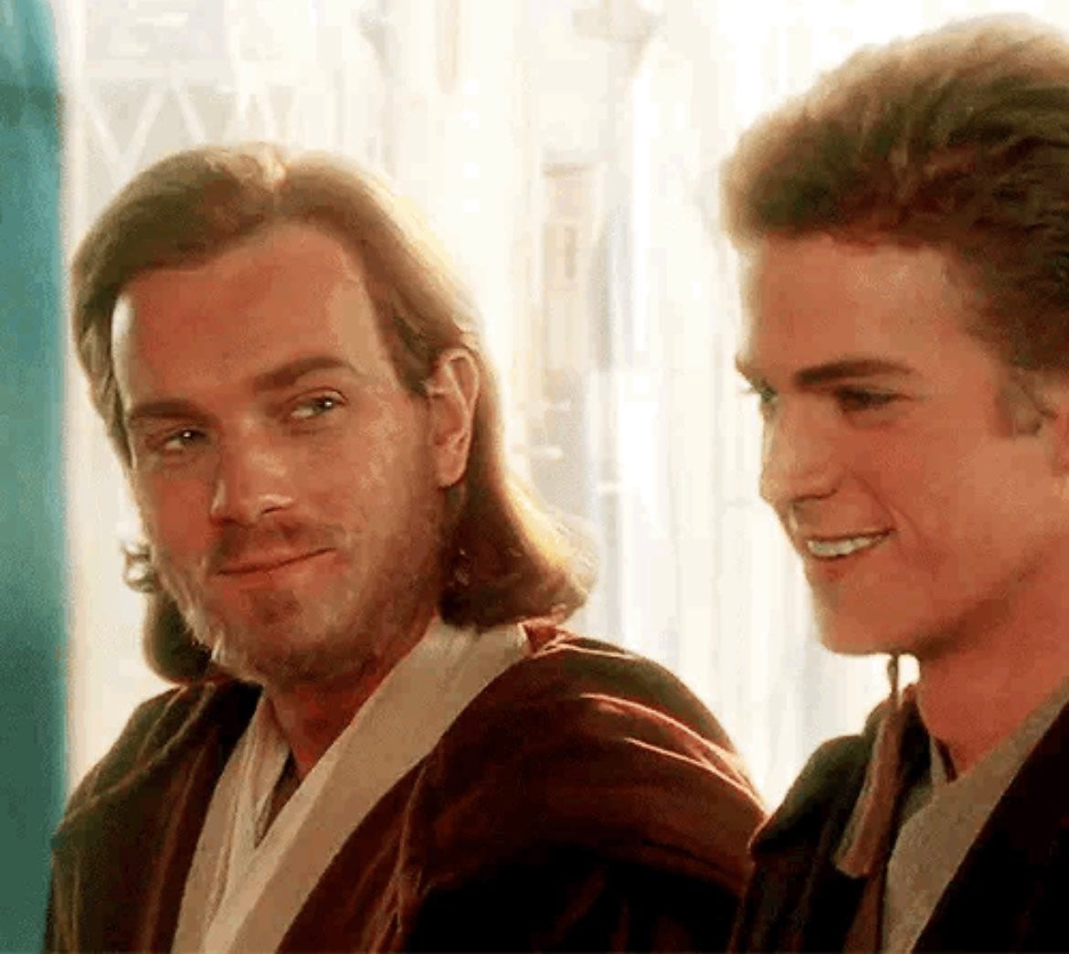 Obi Wan Kenobi looks on with pride at Anakin Skywalker in Attack of the Clones