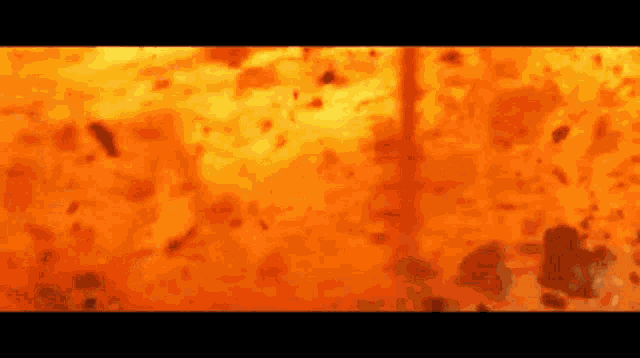 a close up of a fire with a lot of flames coming out of it