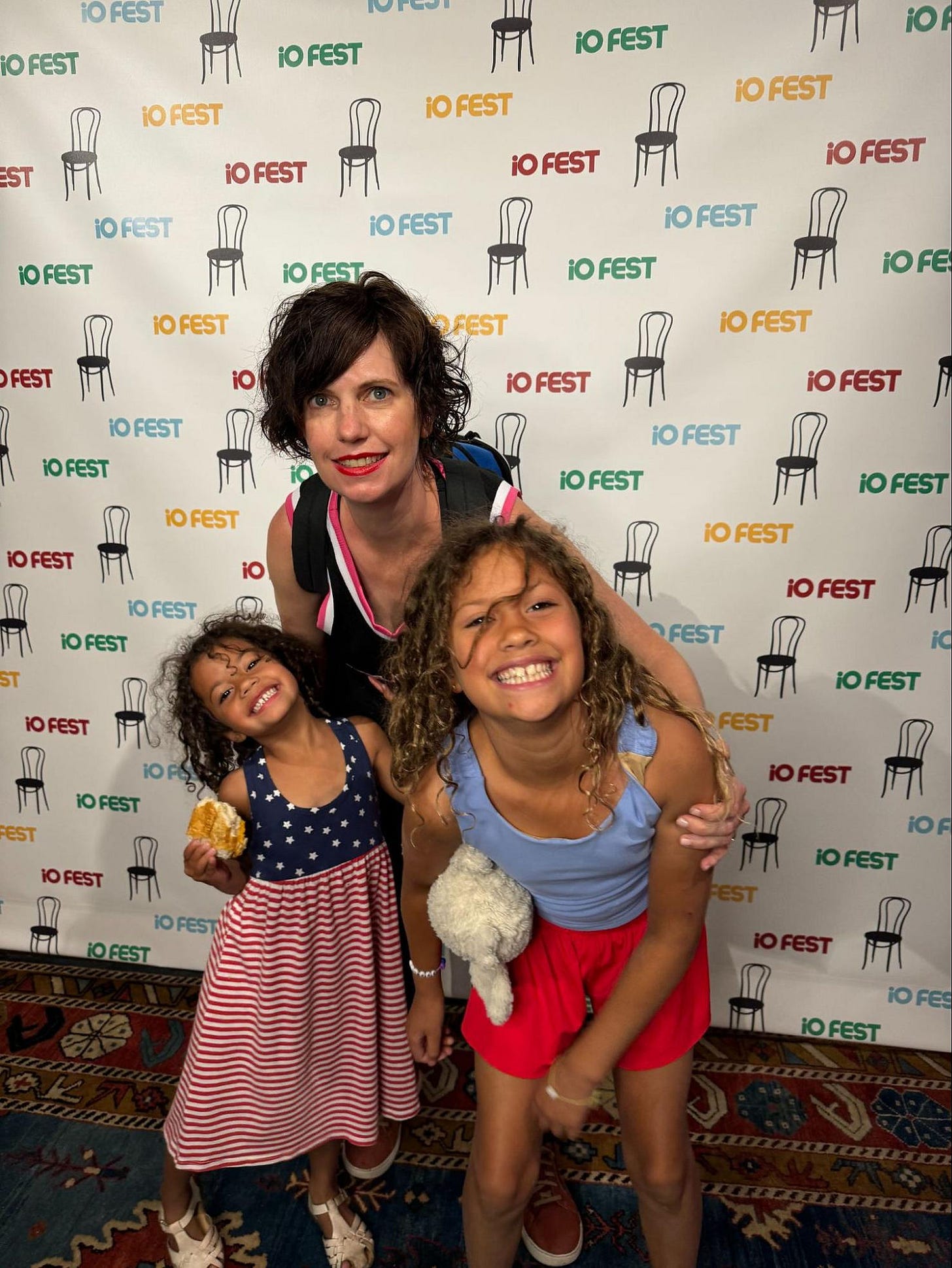 Amy Kraft with her two daughters after performing at the iO Improv Festival in Chicago. Author's own picture.