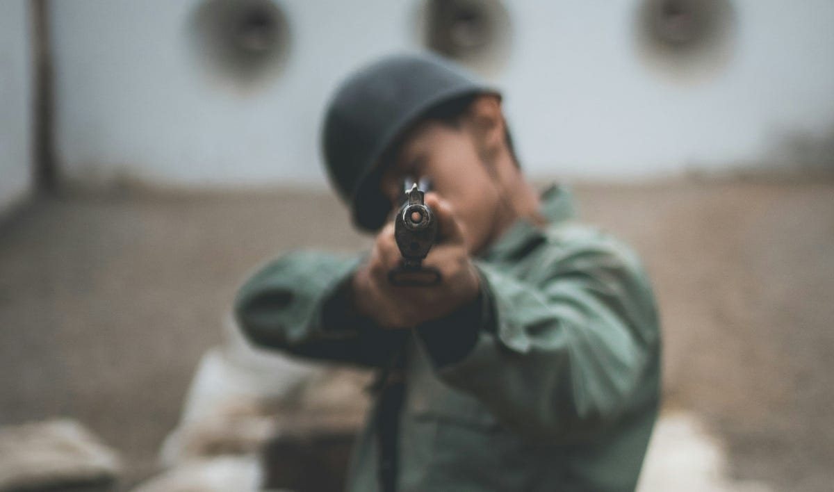 Soldier pointing gun straight at camera Soldier pointing gun straight at camera