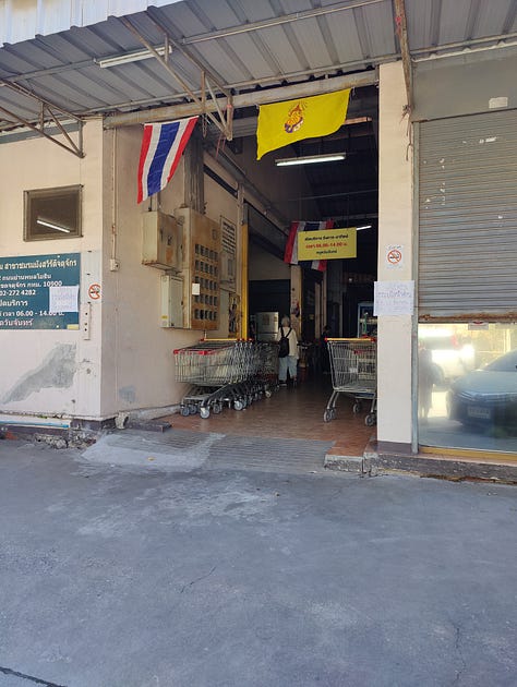 inside the Chamlong's food hall, inside the attached vegetarian store, outside the building