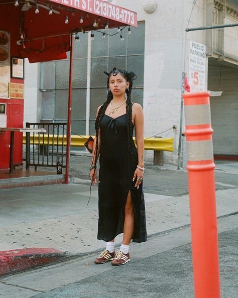 Latina Girl in braids in Paris streets