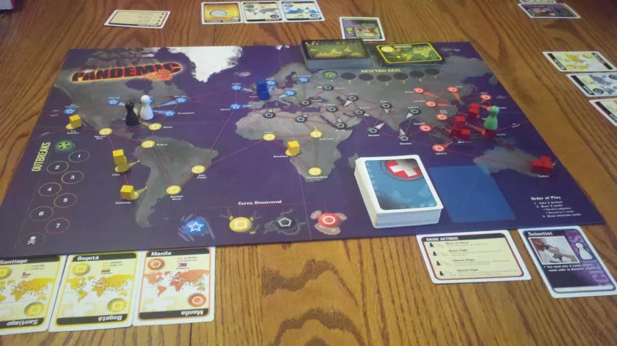 A display of the board game Pandemic laid out being played.