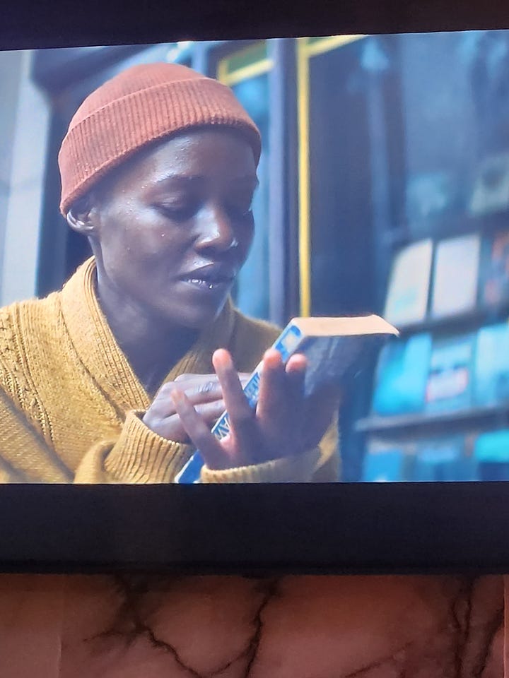 Lupita Nyong'o plays a character surviving an alien attack in NYC and holds Octavia Butler's alien science fiction novel Dawn in her hands.