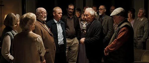 Scene from Hot Fuzz. Nicholas Angel meets the members of the Neighborhood Watch Alliance for a dinner party. Scene from Hot Fuzz. Nicholas Angel meets the members of the Neighborhood Watch Alliance for a dinner party.