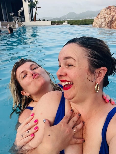 Three photos. From left to right: 1. Amber Tamblyn and Eliza Clark pose together in the pool for a selfie. They both look into the camera with slight, coy smiles. 2. Amber Tamblyn and Eliza Clark pose in the pool together for a selfie. Eliza has her arms around Amber. They both look at the camera with their mouths open, making surprised/excited faces. 3. Amber Tamblyn takes a selfie of her and Eliza Clark in the pool. Eliza is behind Amber making a kissy face with pursed lips. Amber is laughing.