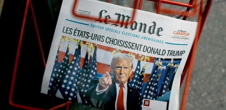 Photo of Le Monde newspaper showing a large photo of Donald Trump Photo of Le Monde newspaper showing a large photo of Donald Trump