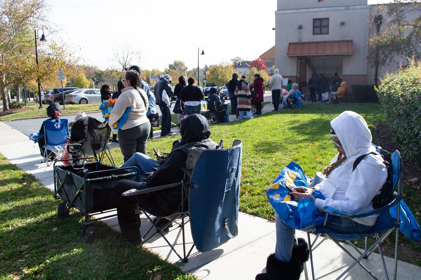 Furloughed federal workers stand in line for hours ahead of a special food distribution by the Capital Area Food Bank and No Limits Outreach Ministries on Barlowe Road in Hyattsville, Maryland, on Tuesday, Oct. 28, 2025. (Photo by Ashley Murray/States Newsroom)