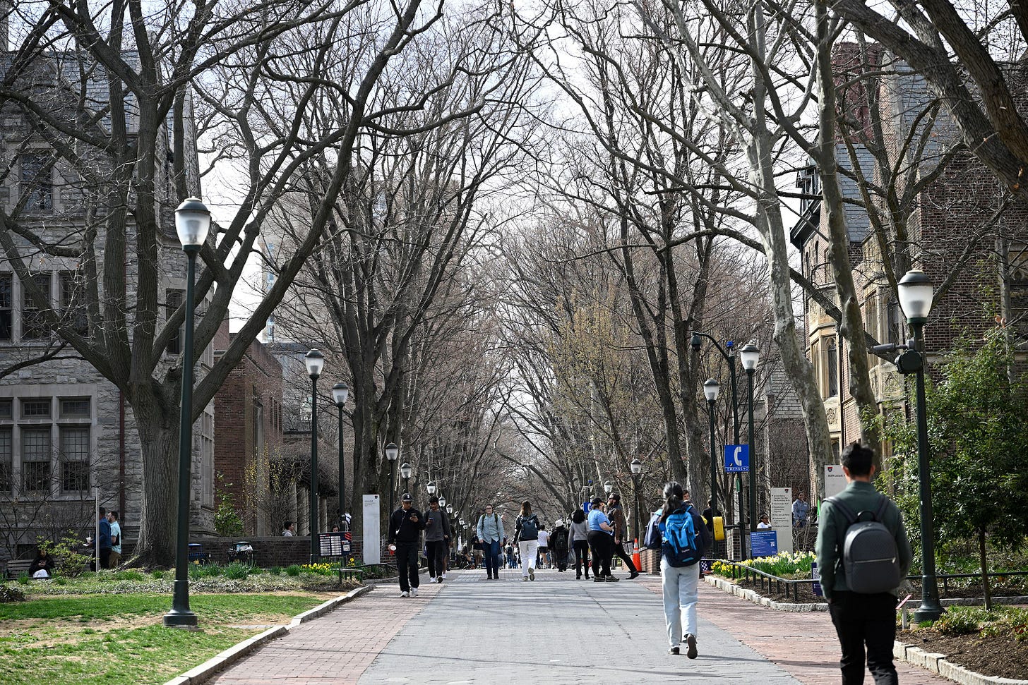 People make their way through the University of Pennsylvania campus, Wednesday, March 19, 2025, in Philadelphia.