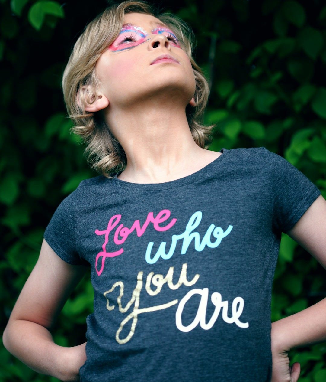 girl standing near plants