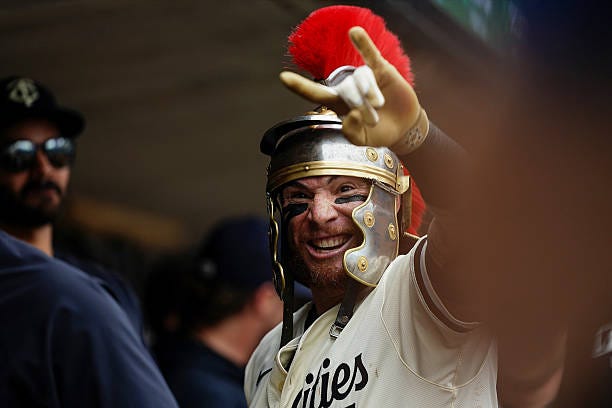 Christian Vázquez of the Minnesota Twins celebrates with teammates after hitting a solo home run in the fourth inning during the game between the...