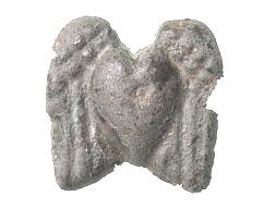 This may contain: three pieces of art are shown on a white background, including an iron mask and two metal sculptures