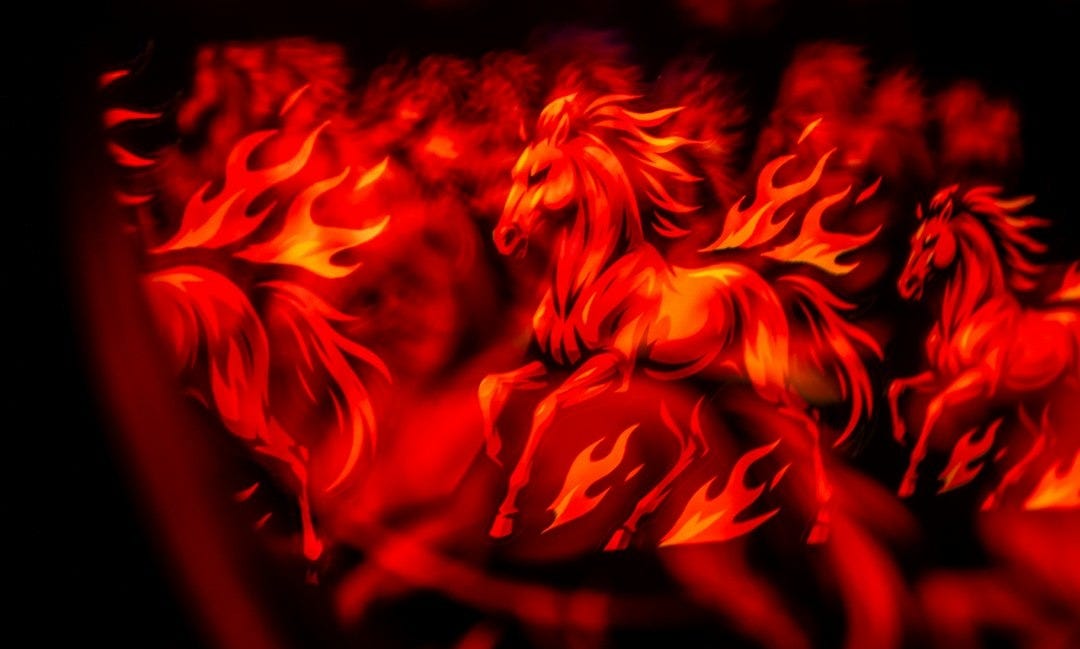 Fiery horses in a dark, abstract setting