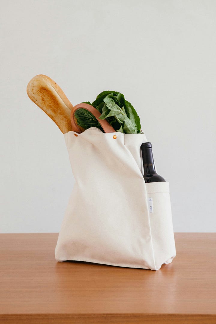 Peaches and an open book. Baguette and vegetables poking out of a tote. Photos by Nataliya Melnychuk and Ginny Rose Stewart via Unsplash.