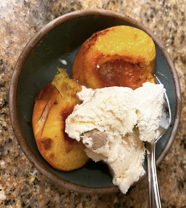 peaches and ice cream in a blue bowl