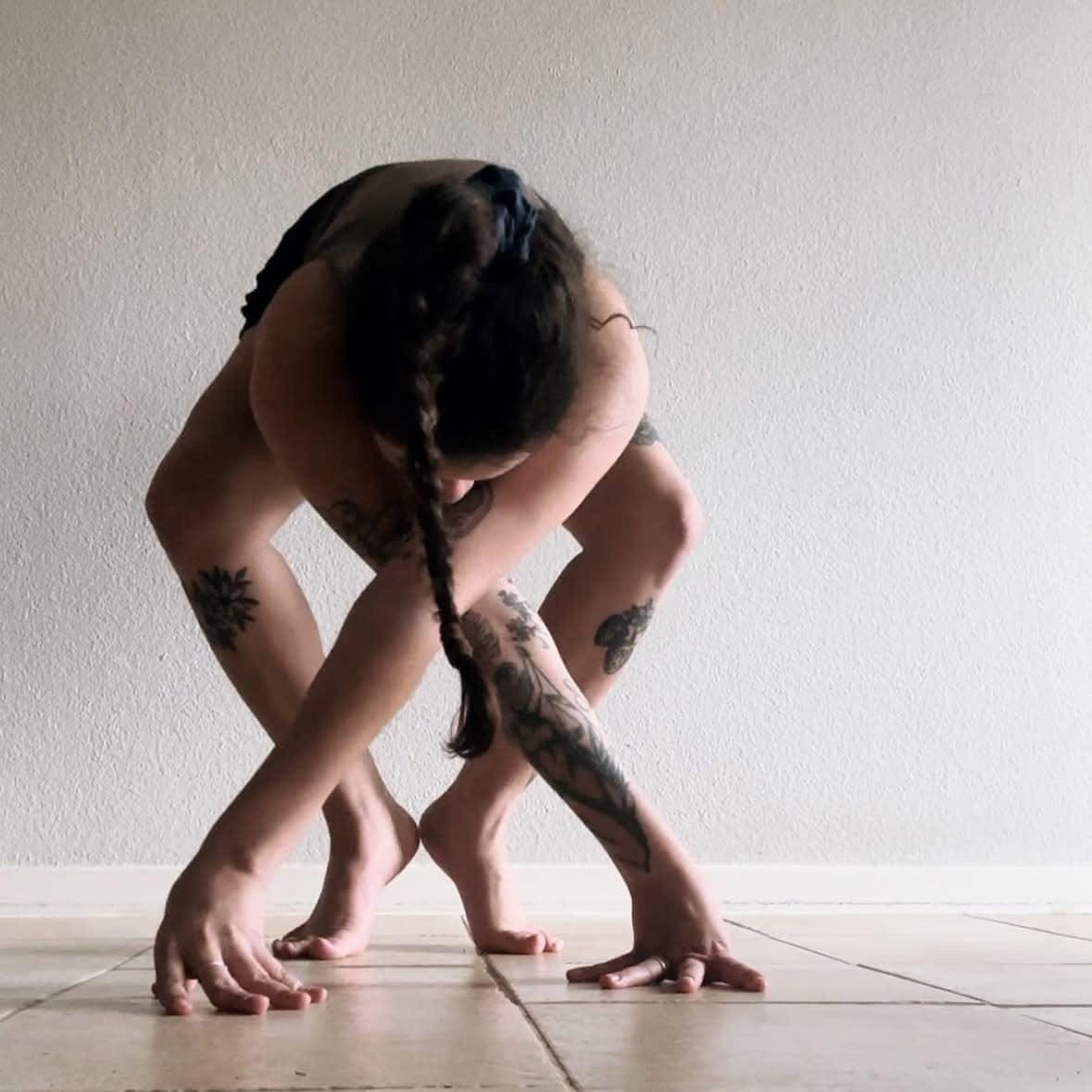 May be an image of 1 person and practicing yoga