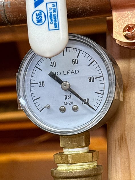 Photos of PEX being installed and a pressure gauge showing it pressurized to 100 psi.