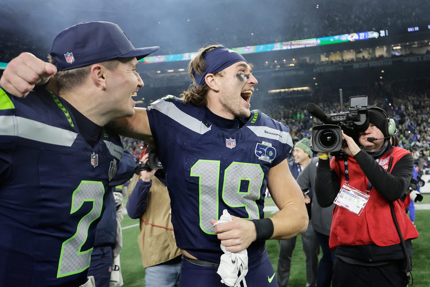 Seattle Seahawks players celebrate winning the NFC Championship after defeating Los Angeles Rams 31-27 at Lumen Field